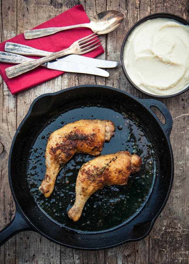 Roasted chicken leg and cauliflower puree with thyme. Paleo cauliflower stock images, royalty-free photos and pictures