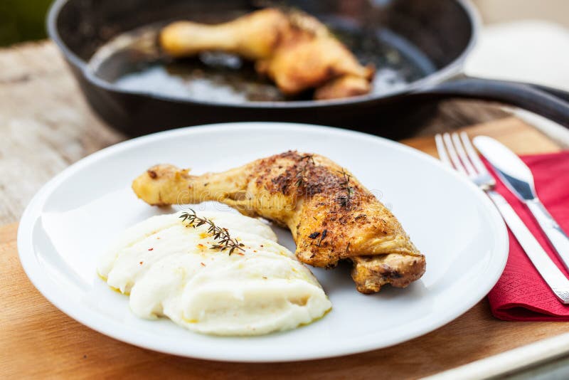 Roasted chicken leg and cauliflower puree with thyme. Paleo cauliflower stock images, royalty-free photos and pictures