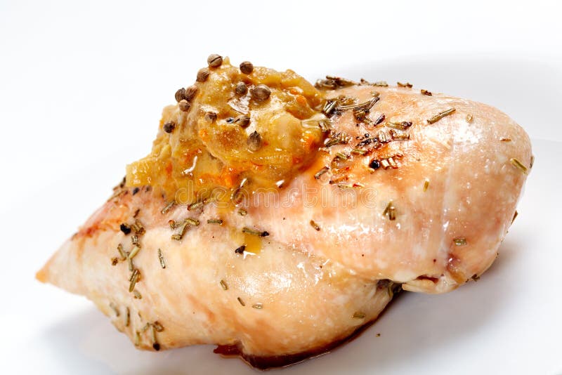 Chicken with Cheese Sauce on White Plate Isolated. Stock Photo Image