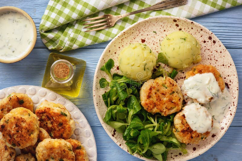 Chicken Cutlets Served with Mashed Potatoes, Salad and Garlic Dip