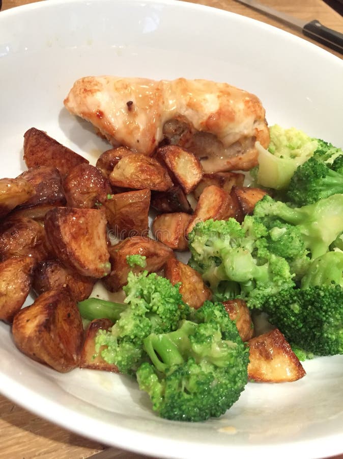 Chicken Dinner with Roast Potatoes and Vegetables Stock Photo - Image