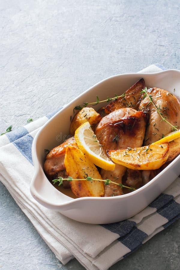 Chicken Drumsticks Baked with Potatoes , Lemon and Herbs Stock Image Image of fork, linen
