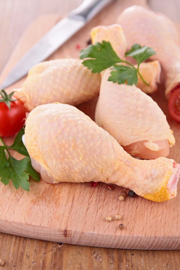 Raw chicken drumsticks stock photo. Image of barbecue 26034070