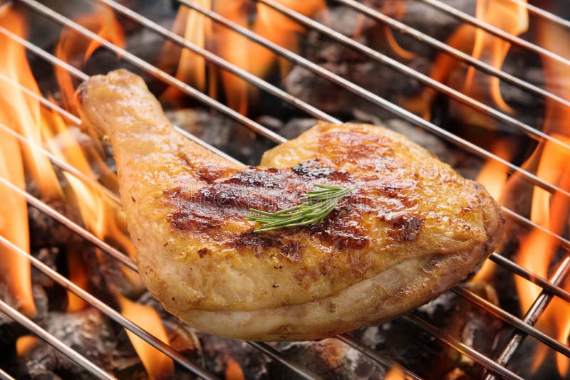 Chicken Leg Grilling Over Flames on a Barbecue Stock Photo Image of