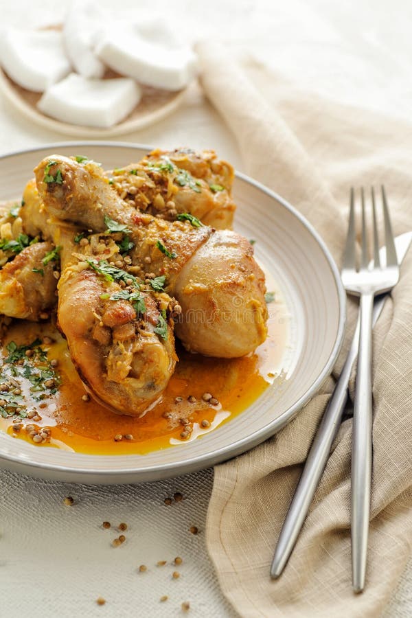 Chicken Legs Braised in Curry and Coconut Sauce. Stock Image Image of
