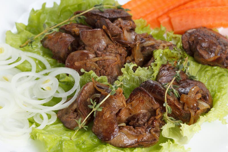 Chicken Liver Cooked with Onions, Lettuce and Spices Stock Image