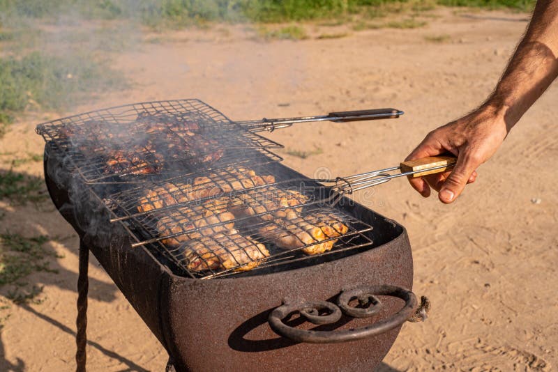 Chicken Meat is Cooked on a Grill in the Backyard Stock Photo Image