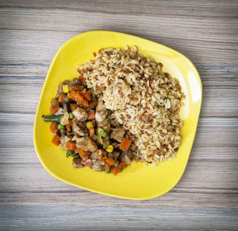 Chicken meat with fried rice and steamed vegetables, serving foo royalty free stock photo Chicken meat with fried rice and steamed vegetables, serving foo royalty free stock photo