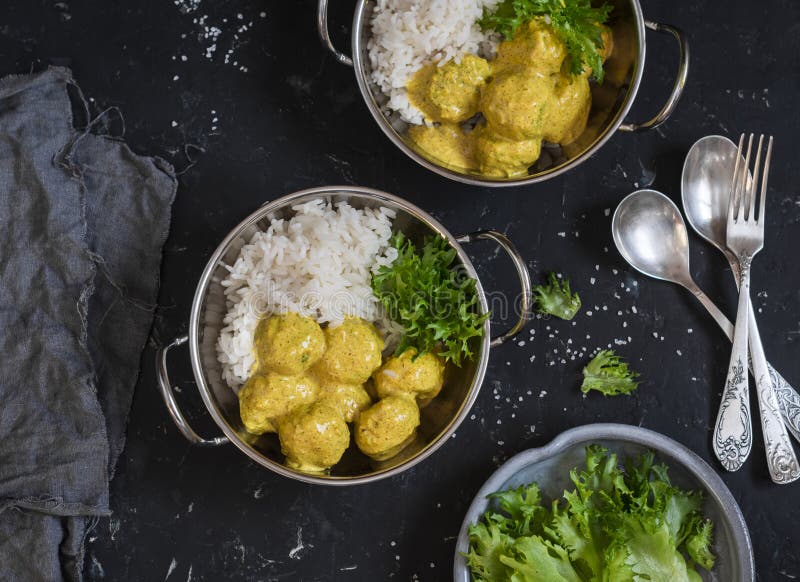 Chicken Meatballs in Curry Sauce and Rice on the Dark Table Stock Image