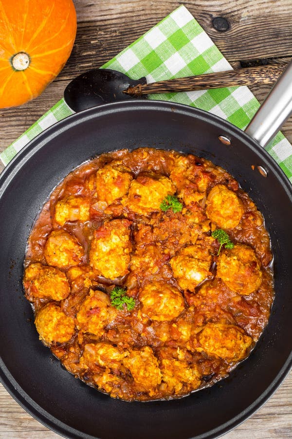 Chicken meatballs with vegetable spicy sauce in the pan