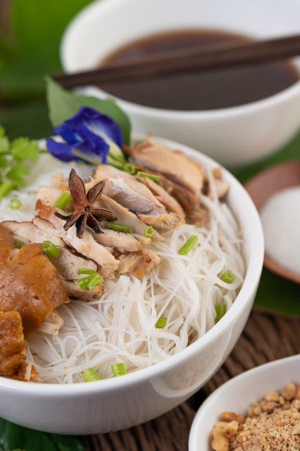 Chicken Noodle in a Bowl with Side Dishes, Thai Food Stock Image