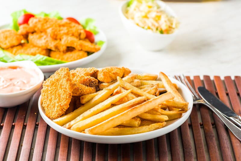 Chicken nuggets with fries stock image. Image of small 85186741