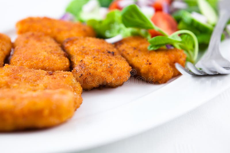 Chicken nuggets with salad