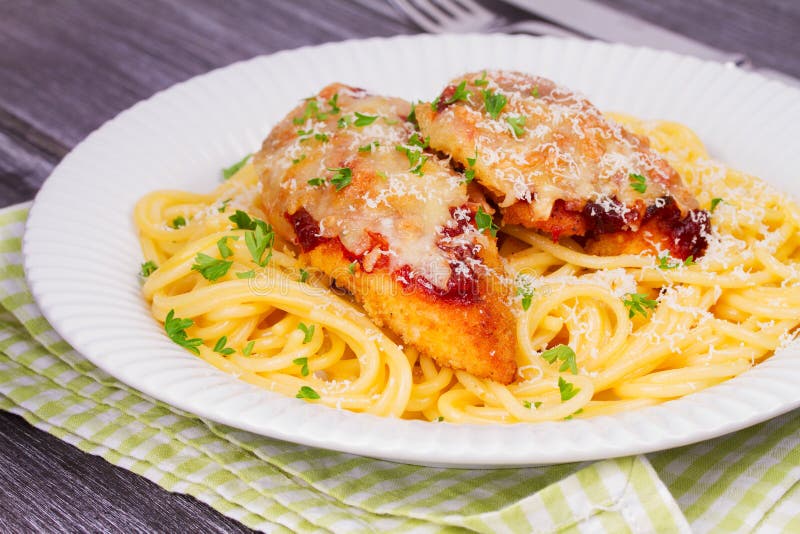 Chicken Parmesan and Pasta. Chicken Breasts and Spaghetti. Stock Photo