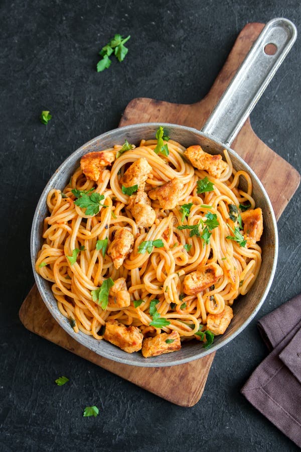 Chicken Pasta with Tomato Sauce Stock Photo - Image of metal, herbs ...