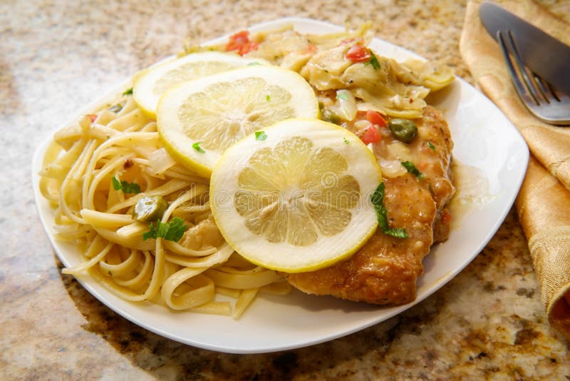 Chicken Piccata Linguine stock photo. Image of fillet - 130655346