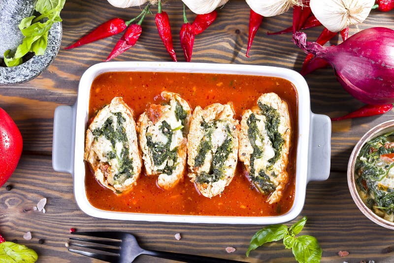 Chicken Rolls with Spinach and Mozzarella in Tomato Sauce Stock Image