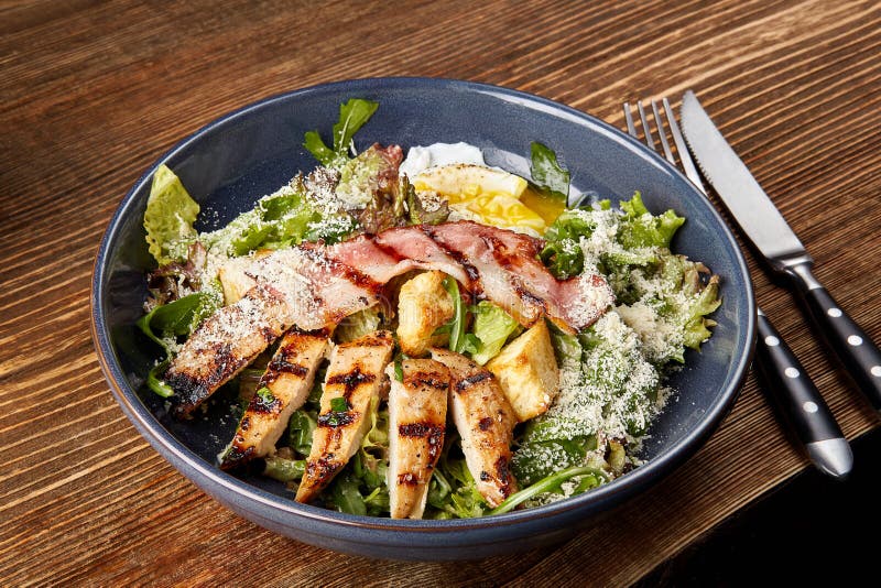 Chicken Salad. Chicken Caesar Salad. Caesar Salad with grilled chicken on plate. Grilled chicken breasts and fresh salad royalty free stock photo Chicken Salad. Chicken Caesar Salad. Caesar Salad with grilled chicken on plate. Grilled chicken breasts and fresh salad royalty free stock photo