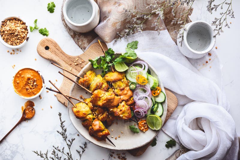 Chicken Satay Skewers with Peanuts Sauce for Summer Barbecue royalty free stock photos Chicken Satay Skewers with Peanuts Sauce for Summer Barbecue royalty free stock photos