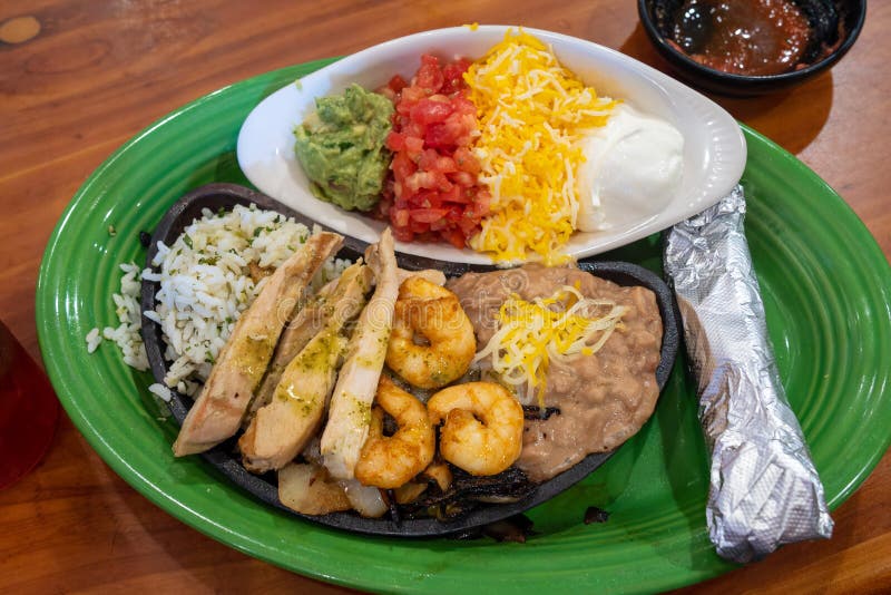 Chicken and Shrimp Fajitas with Refried Beans and Rice Stock Image