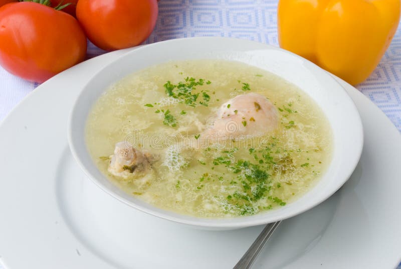 Chicken Soup with Chicken Leg Stock Photo - Image of spoon, tomato: 2920548