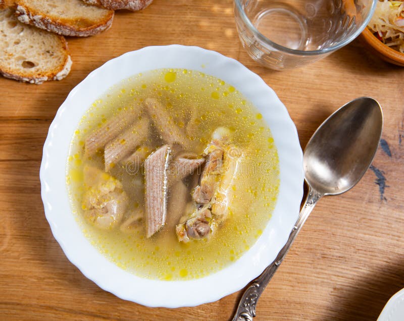 Chicken soup with pasta served in bowl royalty free stock photo