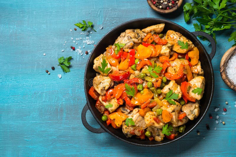 Chicken Stir fry with vegetables on blue table. stock photo Chicken Stir fry with vegetables on blue table. stock photo