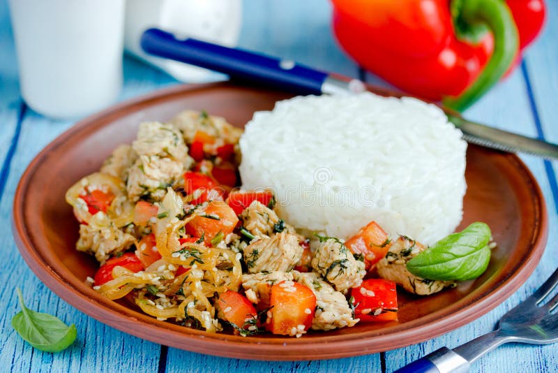 Chicken Stir Fry with Vegetables and Sesame Served with Rice Stock