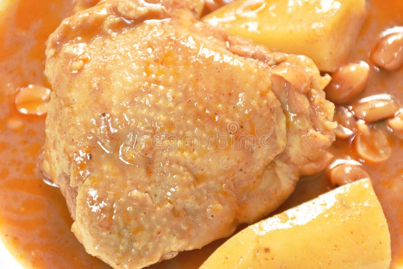 Chicken Thigh Massaman Curry with Slice Potato and Peanut on Plate
