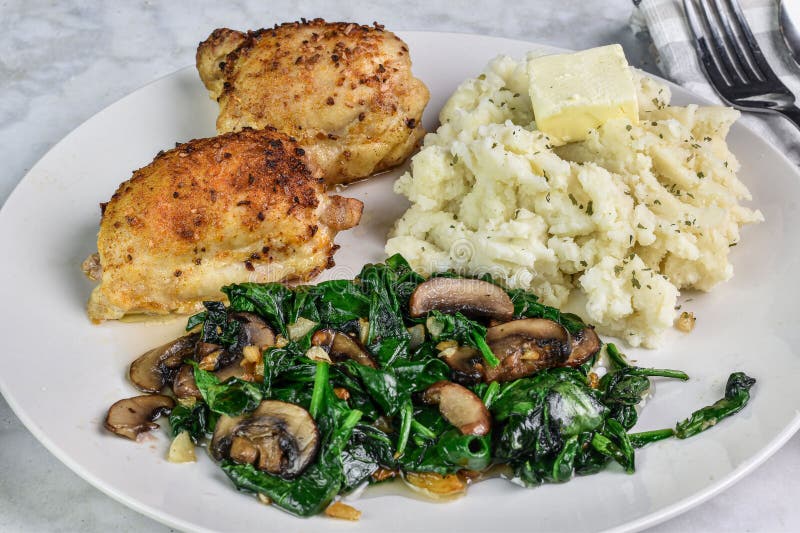 Chicken Thighs with Sauteed Spinach and Mushrooms Stock Image - Image