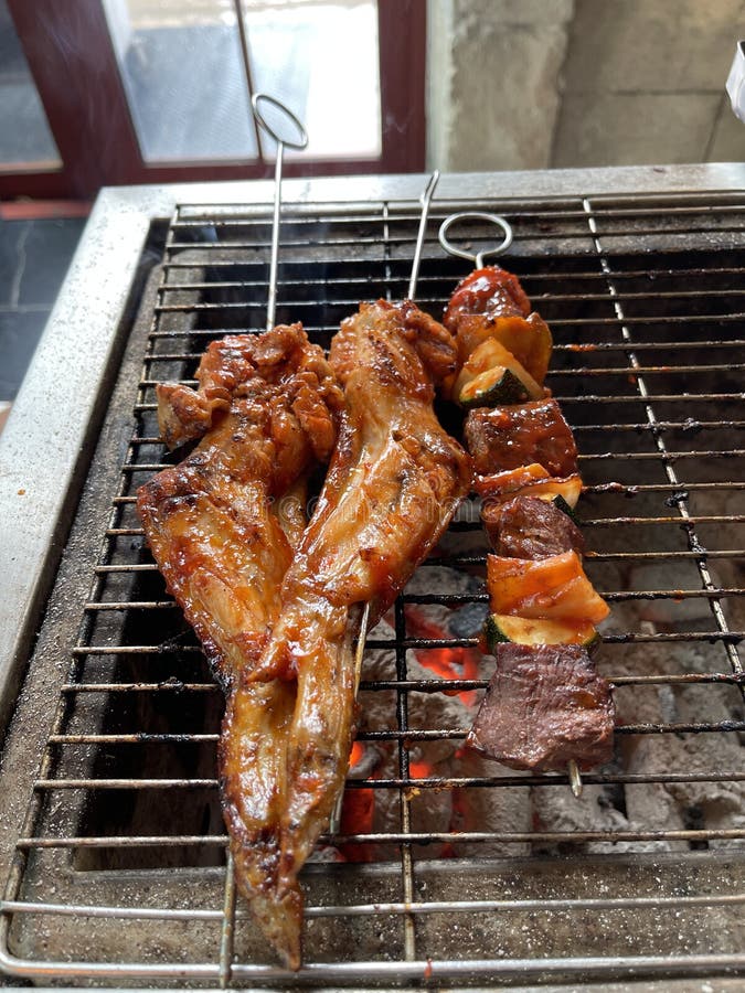 Chicken Wings and BBQ are Grilled on the Stove. Stock Photo Image of