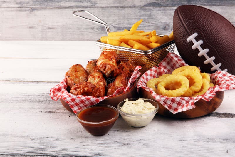 Chicken Wings, Fries and Onion Rings for Football on a Table. Great for ...