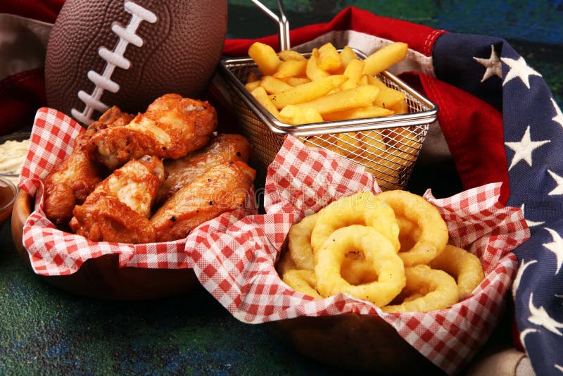 Chicken Wings, Fries and Onion Rings for Football on a Table. Great for ...