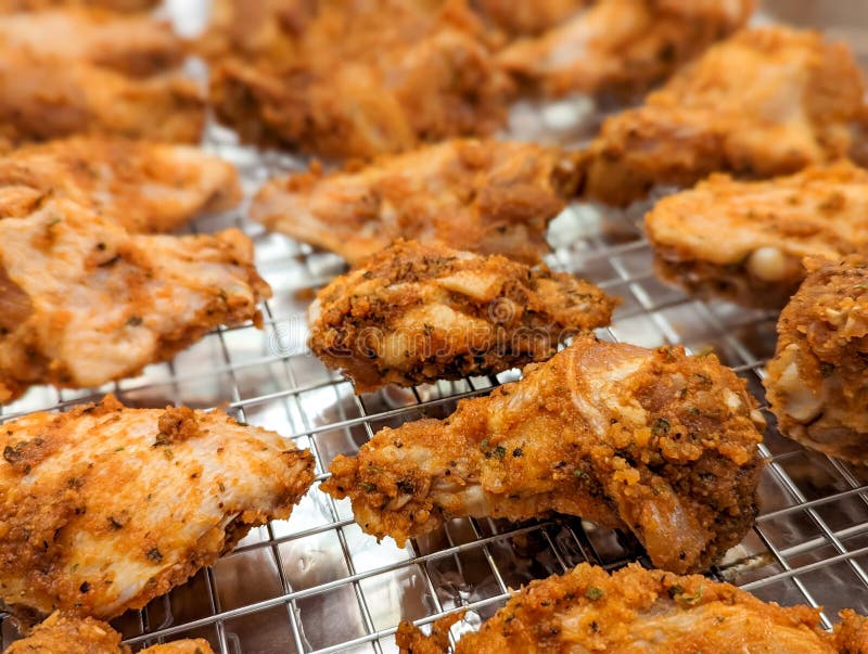 Chicken Wings in a Marinade on a Baking Sheet. Cooking Chicken with