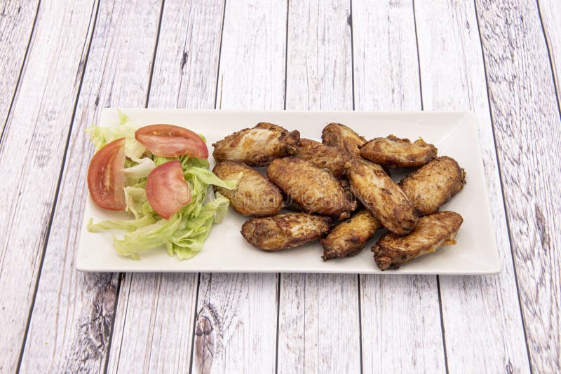 Chicken wings with salad stock photo. Image of meat - 217834068