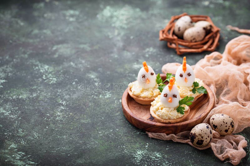 Chickens from eggs. Easter appetizers for party stock photography