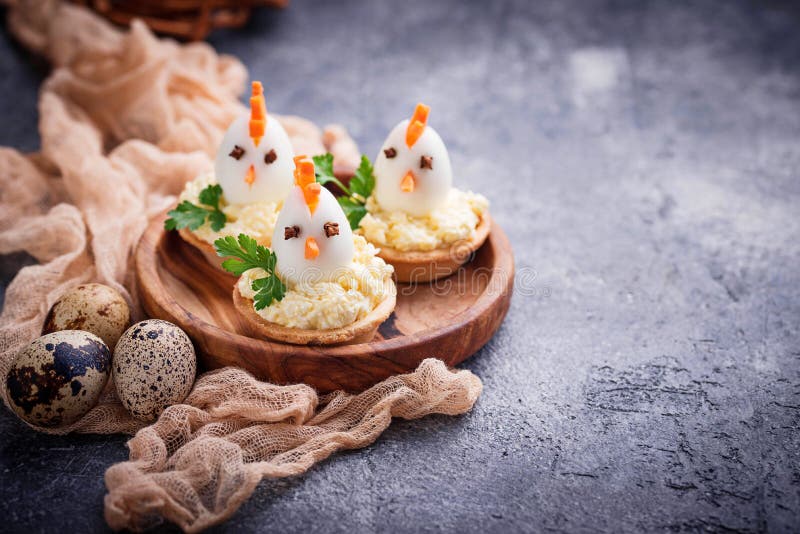 Chickens from eggs. Easter appetizers for party stock images