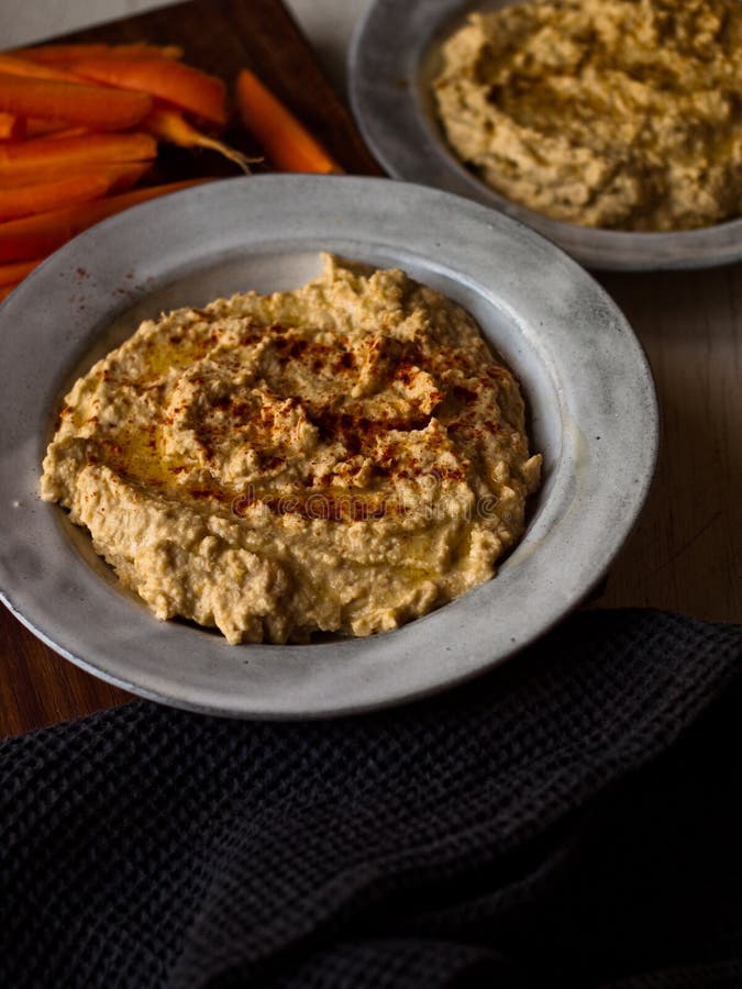 Chickpea Hummus Home Made in Natural Light on Farm Table Stock Photo