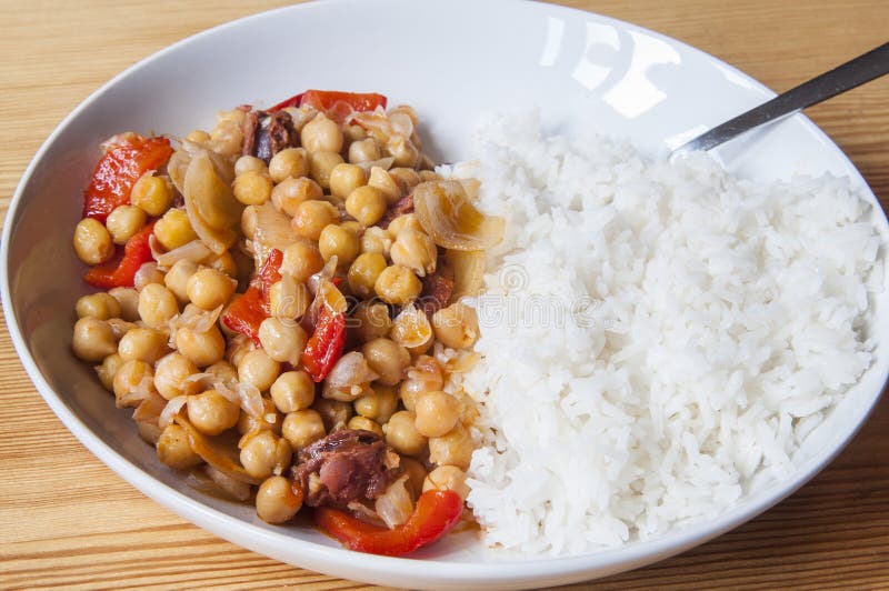 Cut Spanish Sausage or Salami Chorizo. Isolated on White Stock Image