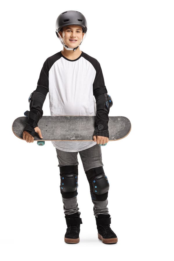 Chico con patineta, casco y toallas de seguridad imagenes de archivo Chico con patineta, casco y toallas de seguridad imagenes de archivo