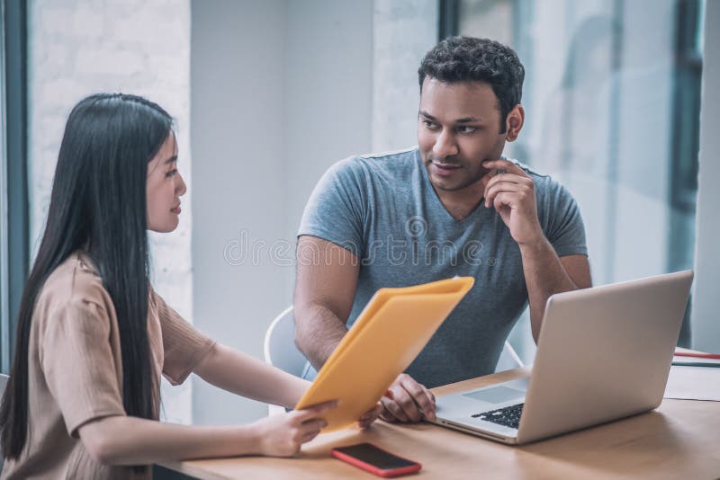 A chief and his assistant working in the office stock photos