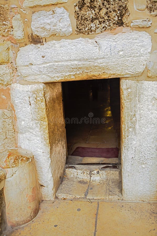 The main access to the Church of the Nativity in Bethlehem is this Liliputian and simple door in the main façade known as `Door of Humility`. It dates back to the Ottoman period and its small size meant to prevent carts being driven in by looters, and to force even the most important visitor to dismount from his horse as they entered the holy place. The doorway was reduced from an earlier Crusader doorway, the pointed arch of which can still be seen above the current door. The main access to the Church of the Nativity in Bethlehem is this Liliputian and simple door in the main façade known as `Door of Humility`. It dates back to the Ottoman period and its small size meant to prevent carts being driven in by looters, and to force even the most important visitor to dismount from his horse as they entered the holy place. The doorway was reduced from an earlier Crusader doorway, the pointed arch of which can still be seen above the current door.