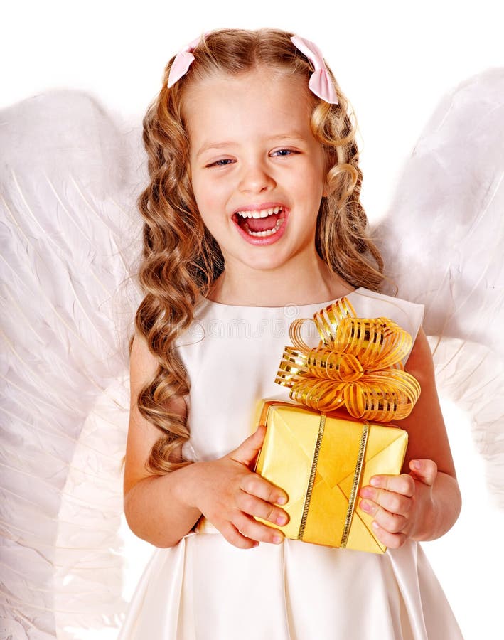 Child at angel costume holding gift box. Happy child at angel costume holding gift box royalty free stock photography Child at angel costume holding gift box. Happy child at angel costume holding gift box royalty free stock photography