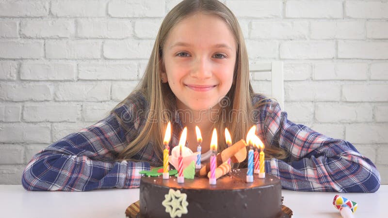 Child Birthday Party Blowing Candles, Children Anniversary, Kids Celebration stock photos Child Birthday Party Blowing Candles, Children Anniversary, Kids Celebration stock photos