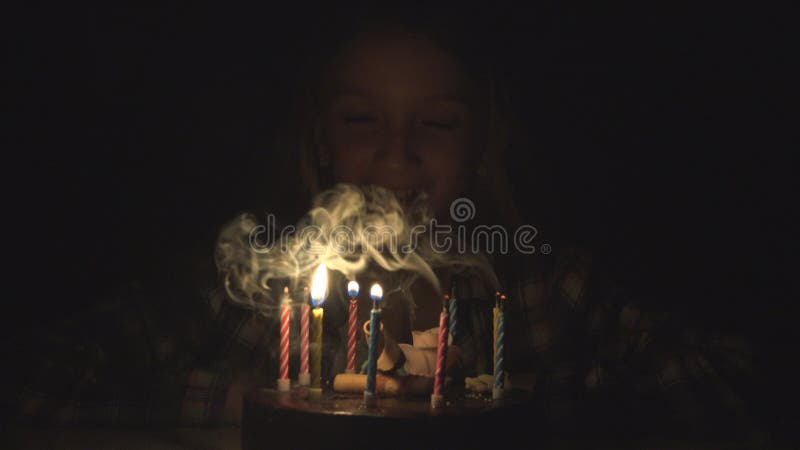 Child Birthday Party Blowing Candles in Night, Children Anniversary Celebration royalty free stock photo Child Birthday Party Blowing Candles in Night, Children Anniversary Celebration royalty free stock photo