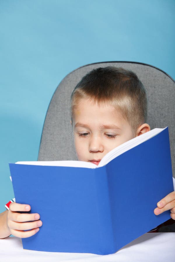 Child Boy Kid Reading A Book On Blue Stock Photo Image Of Knowledge