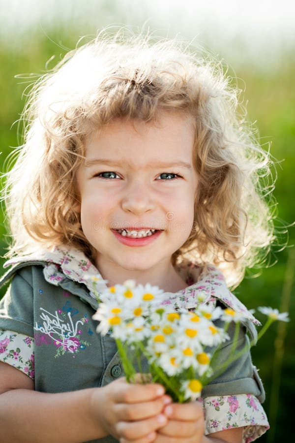 Child with Flowers. Gift for Mothers Day Stock Photo Image of