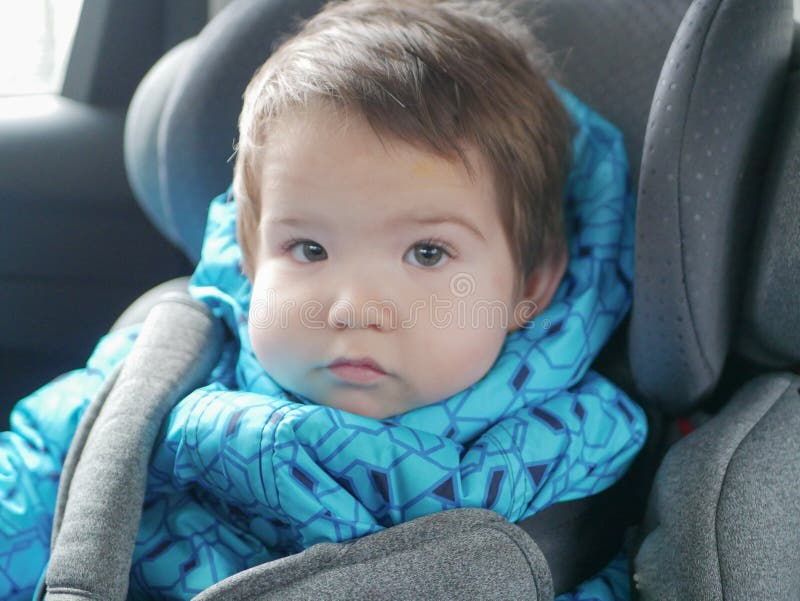 Child in a Car Seat. Child Safety in the Childs Car Seat during Sleep