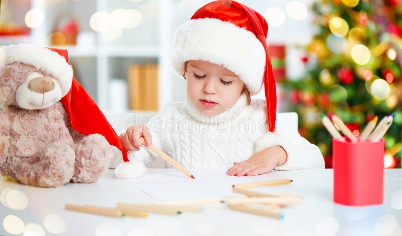 Child before Christmas writes a letter to Santa royalty free stock photos Child before Christmas writes a letter to Santa royalty free stock photos