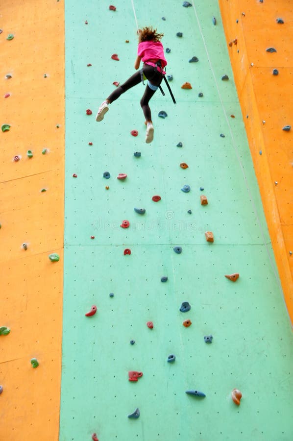 Child climbing down the wall